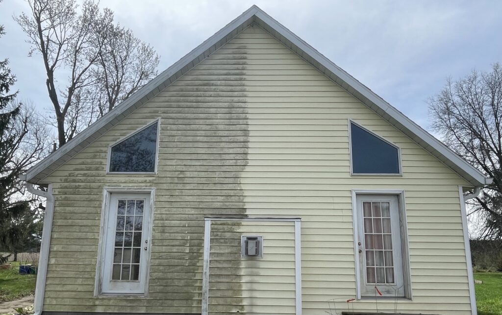 Soft-wash house washing on a vinyl-sided home in Lima, Ohio