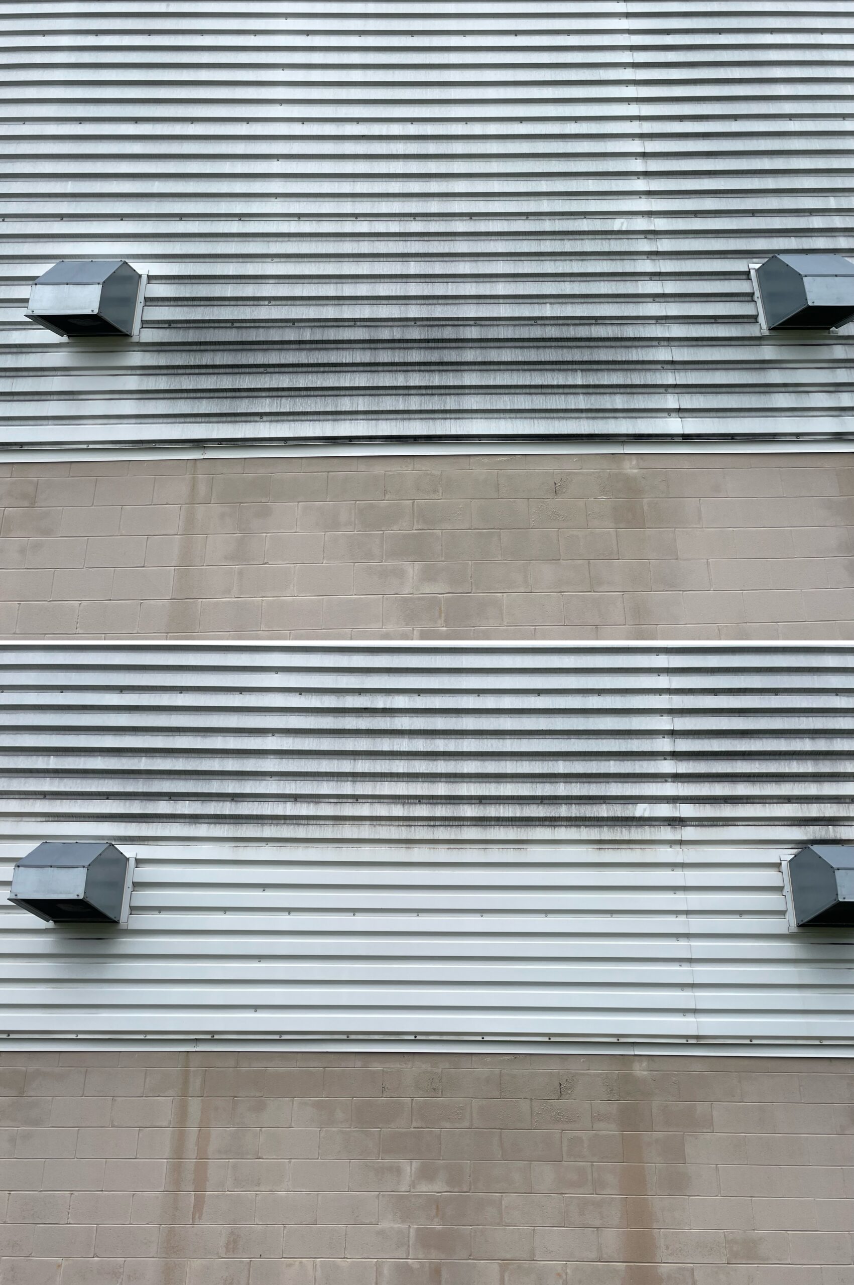Before‑and‑after exterior cleaning comparison showing a soft wash clearing away algae, grime, and organic staining to restore bright, clean siding on a home in Forest Ohio by Ohio Wash Boss.